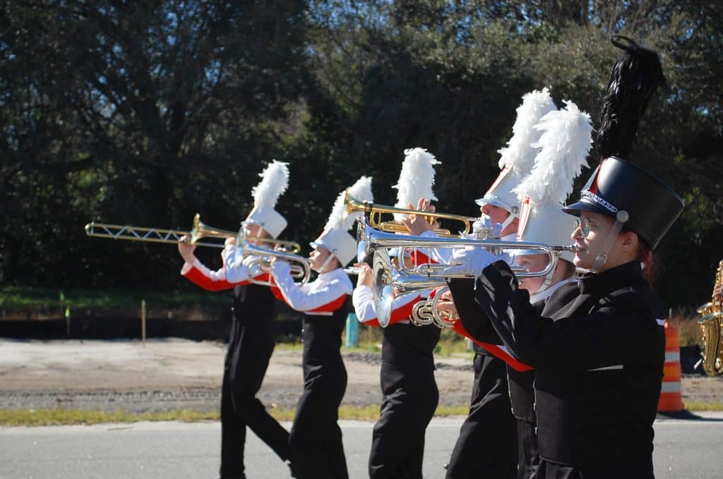 The image shows the Oviedo High School Band performing at the annual Dr. Martin Luther King Jr. parade.