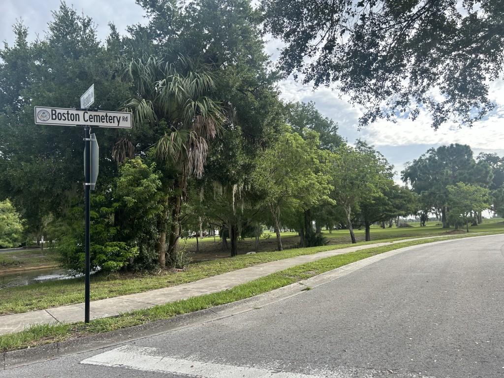 A photo of the paved Boston Cemetery Road