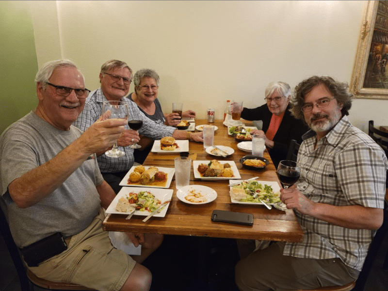 Dennis Dulniak (left, center) enjoys a Dementia-Friendly Dining experience at The Meatball Stoppe.